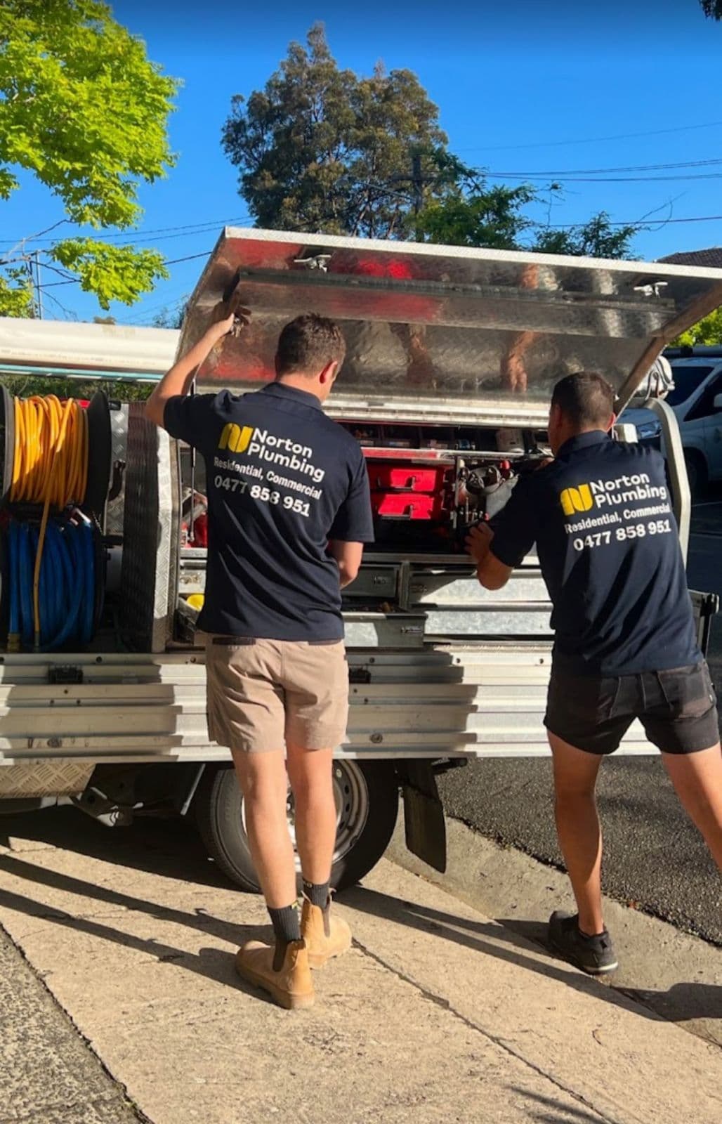Norton Plumbing team loading equipment for a strata maintenance job, Eastern Suburbs apartment block
