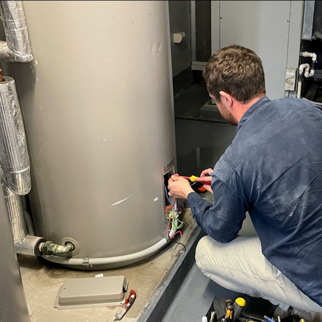 Adam diagnosing a faulty hot water system — Norton Plumbing Eastern Suburbs