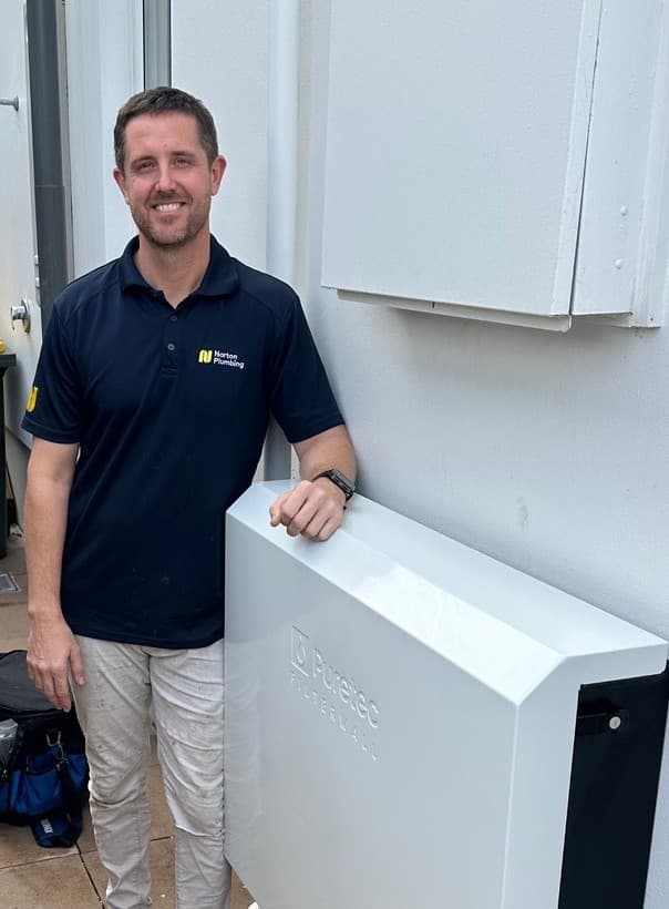 Adam Norton installing a Puretec FilterWall whole-home water filter at a Clovelly home, Eastern Suburbs Sydney