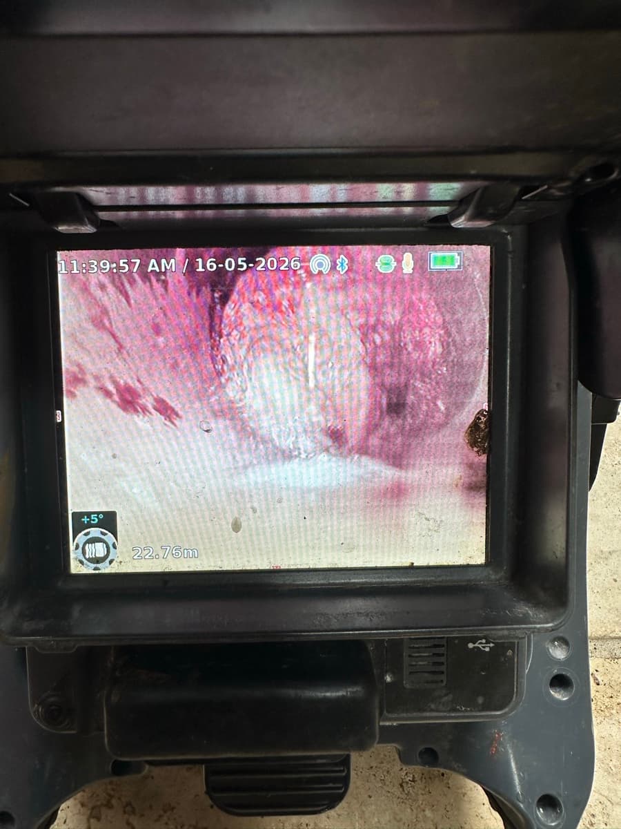 CCTV camera screen showing tree roots blocking a clay sewer pipe at 22.76 metres in South Coogee