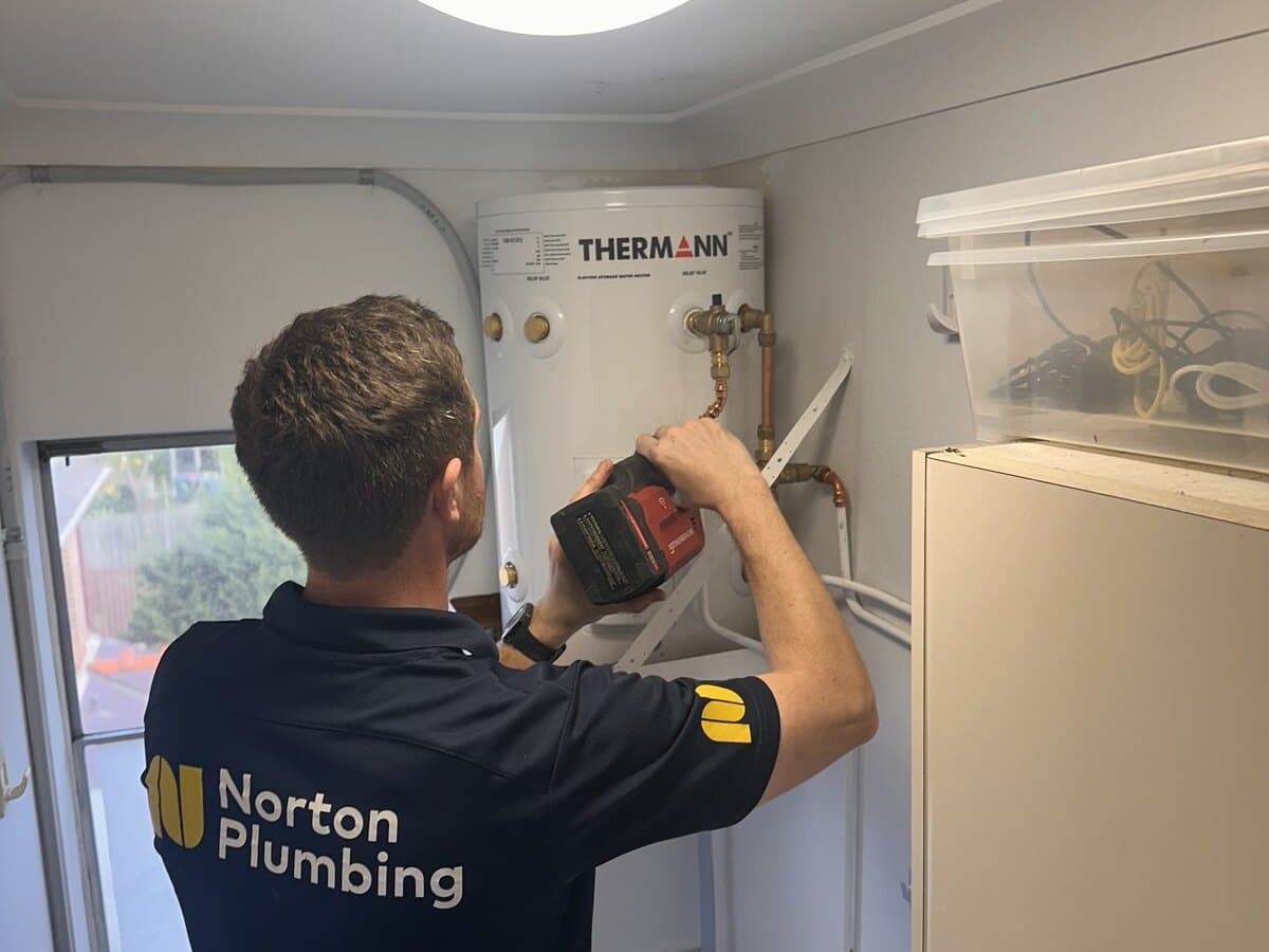 Norton Plumbing installing a Thermann electric storage hot water system, Eastern Suburbs Sydney